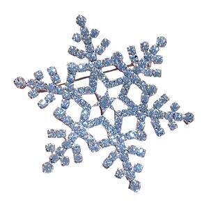 Silver snowflake brooch ornate festive pin covered in white rhinestones filigree